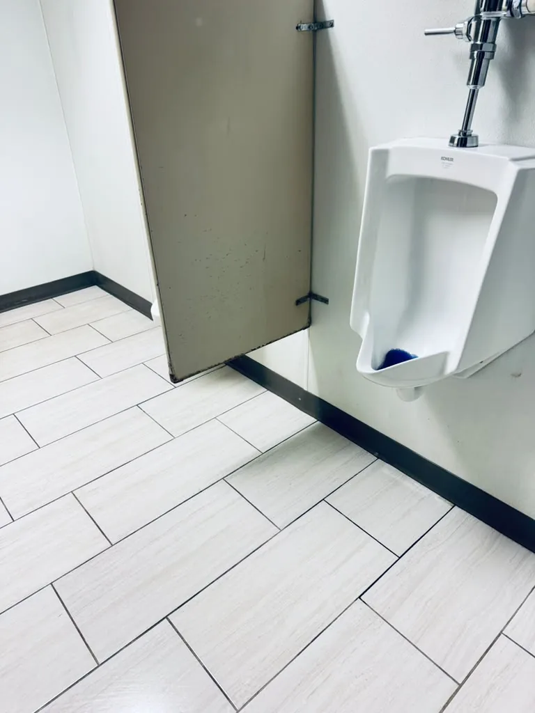 Commercial restroom floor after a deep cleaning by 7 General Services — spotless tile, Greater Boston, MA