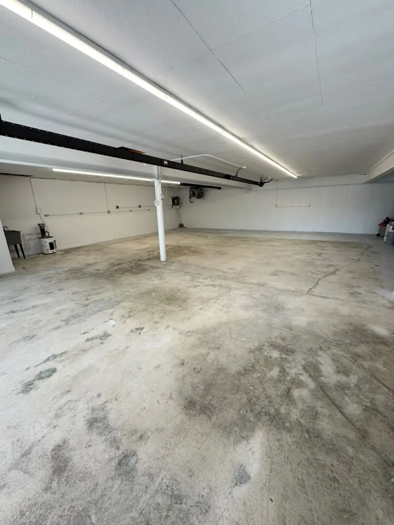 Large space before floor painting — bare, stained concrete, Greater Boston, MA
