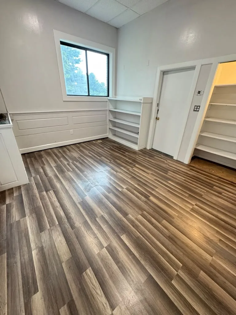 Interior room after professional painting by 7 General Services — clean white walls and trim, Greater Boston, MA