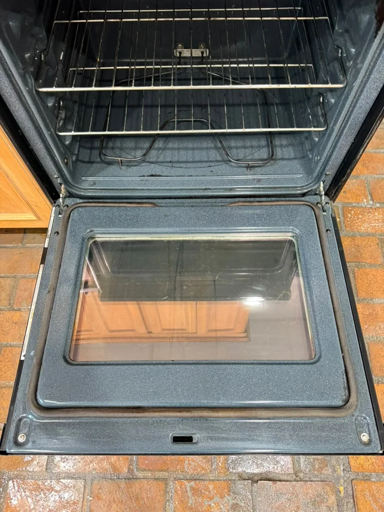 Oven interior after a deep cleaning by 7 General Services — clean racks and glass door, Greater Boston, MA