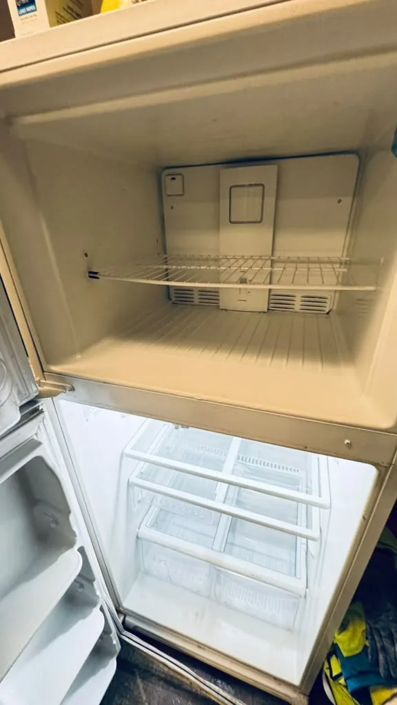 Refrigerator and freezer interior after a deep cleaning by 7 General Services — clean shelves, Greater Boston, MA