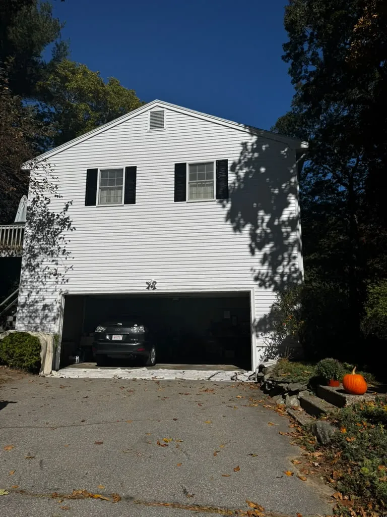 Repainted house exterior with garage in Middlesex County, MA